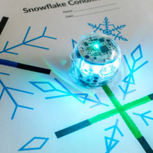 A picture of the Snowflake Conditionals STEM activity. Students use Ozobot to detect the color of each snowflake.