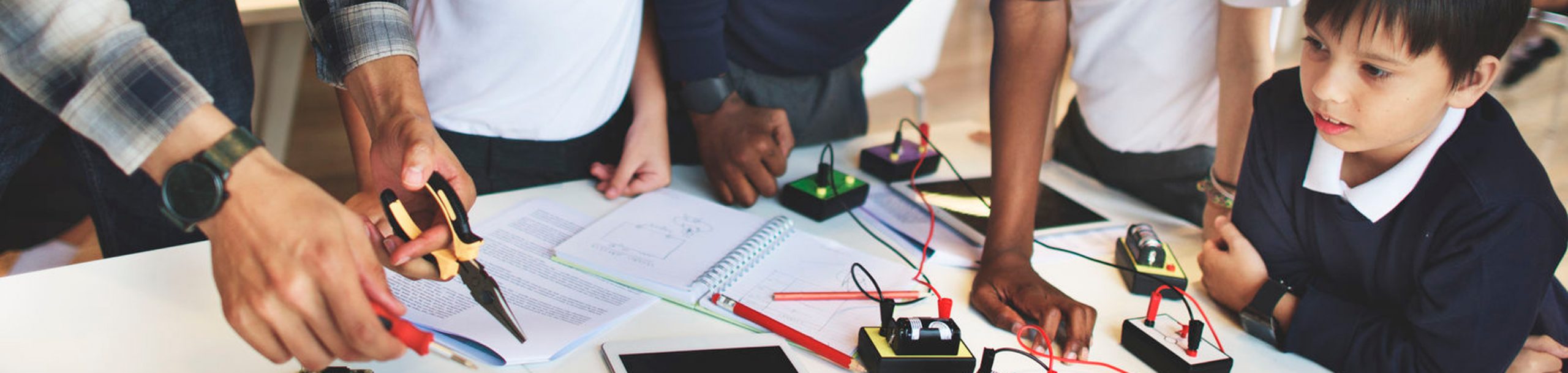 Teacher and students at a Makerspace