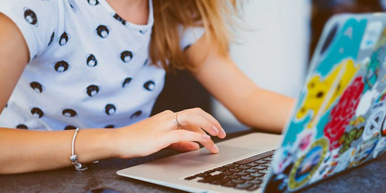 Teenage girl working on a laptop