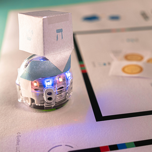 Students use Ozobot Color Codes to program Evo coding robot to mimic a spinning dreidel in this STEM activity for all grade levels