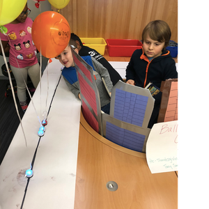 Students create a parade path using color codes for Evo to follow in this Thanksgiving STEAM lesson