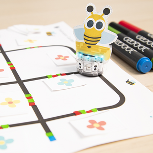 July Lesson Spotlight 2023: Evo dressed up as a bee as it moves around an interactive flower garden model to demonstrate pollination